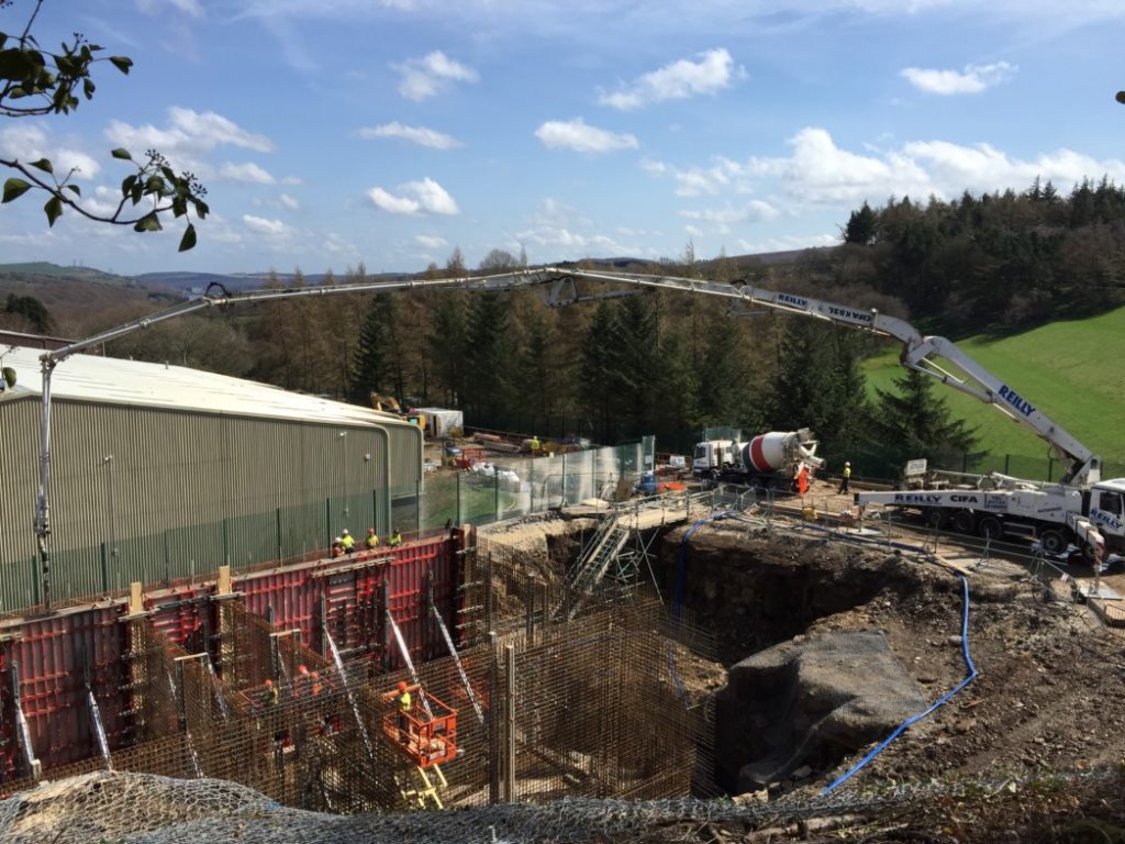 Concrete is piped into the site