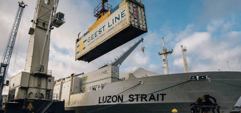 Heavy lifting equipment unloading shipping containers